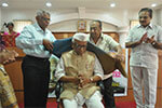   Dignitaries felicitating Dr. H. Sreenivasaiah, President, Karnataka Gandhi Smaraka Nidhi, Bengaluru.